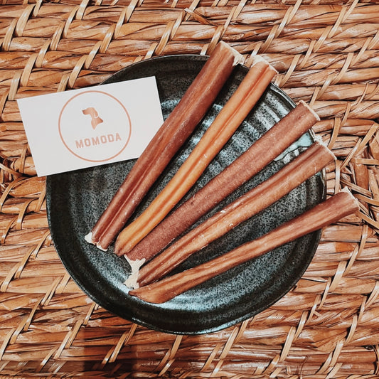 Delicious odor free 6 inches bully sticks on a plate with no additives.